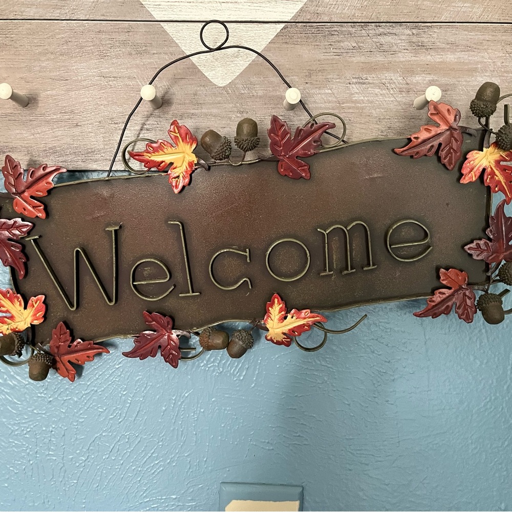 Metal sign that says Welcome